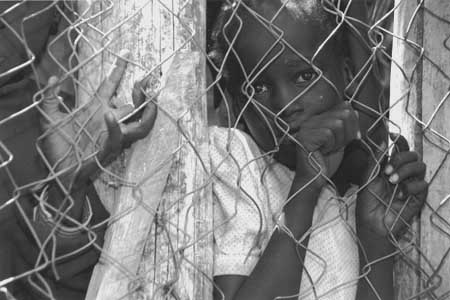 GIRL THROUGH FENCE