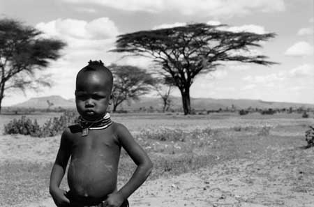 TURKANA GIRL WITH TREE